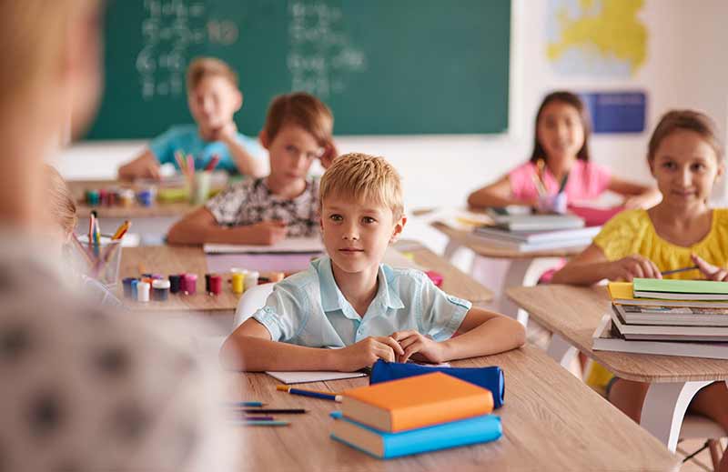 children1 children at their desks in class